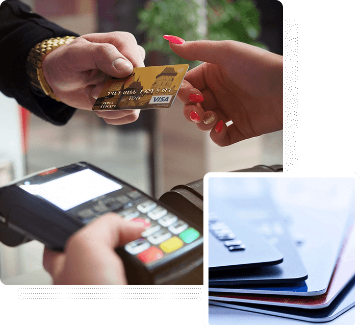 A person holding a credit card over a payment terminal.