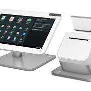 A tablet and a receipt printer on top of a stand.